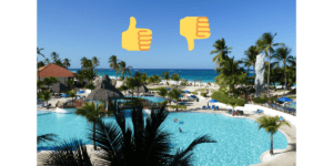 a high level view of a resort with a pool in the foreground. A thumbs up and a thumbs down image are at the top of the image.