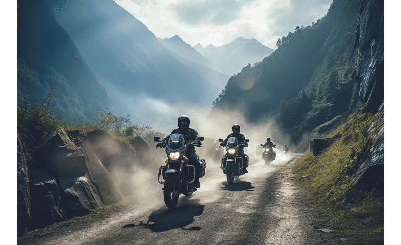 A group of motorcycle riders riding through the mountains